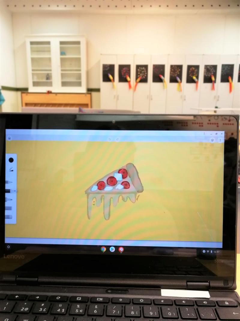 Oppilaan piirustusohjelmalla piirtämä pizzapala.